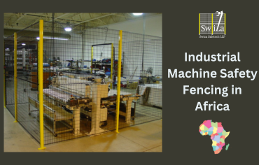 Industrial machine safety fencing protecting workers in an African factory.